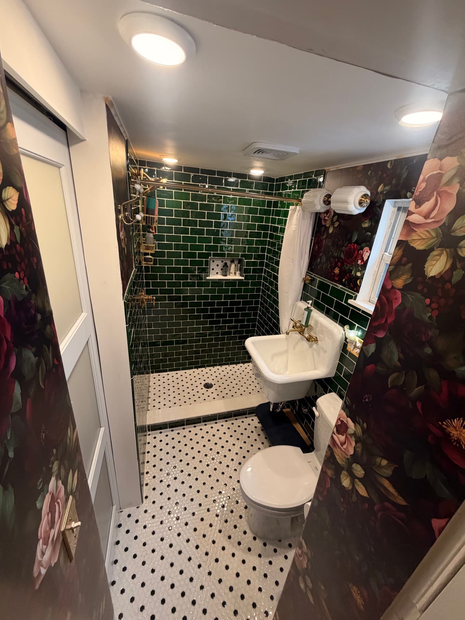 Finished bathroom with green subway tile shower