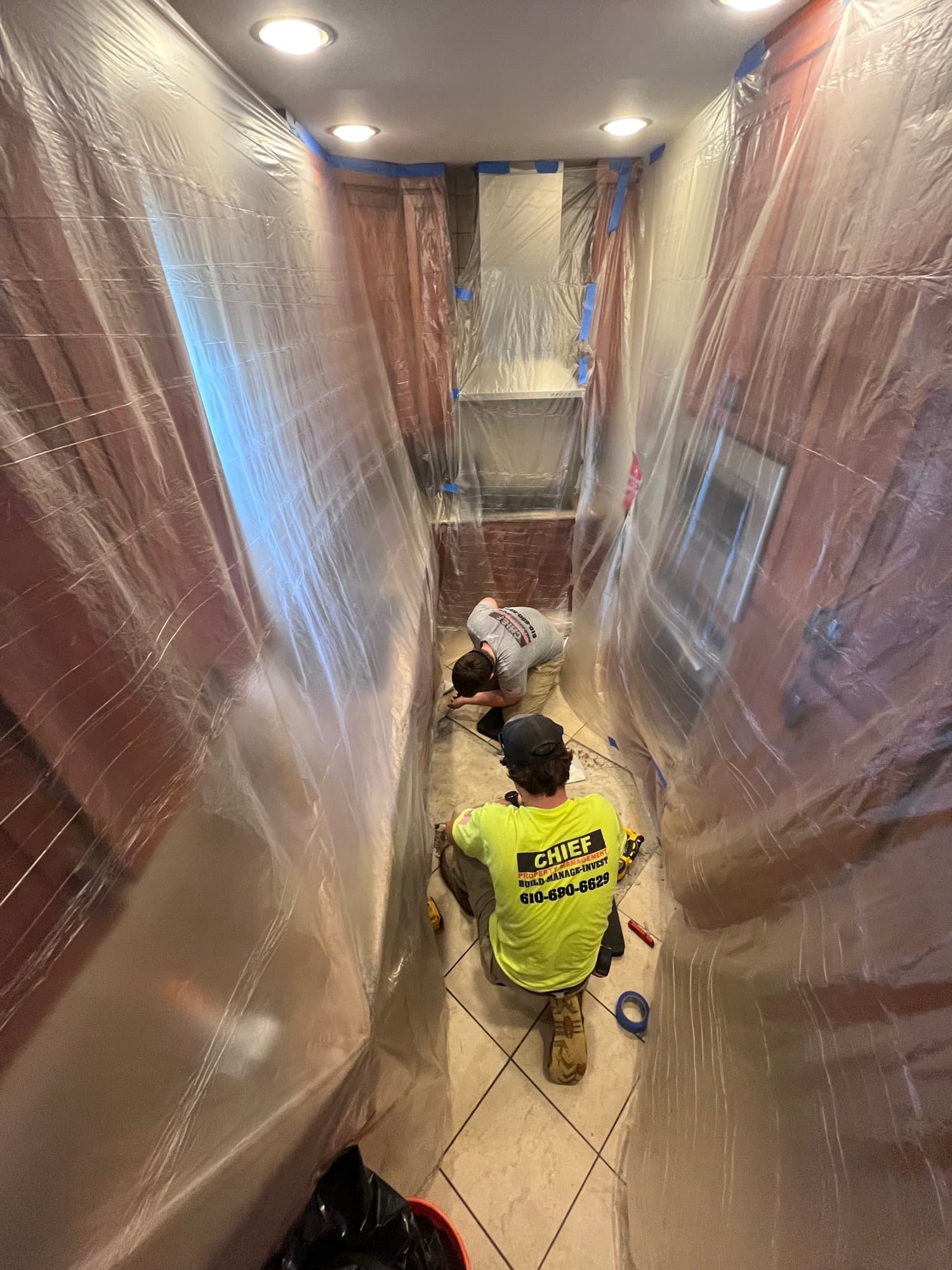 Chief crew tiling a bathroom mid-renovation