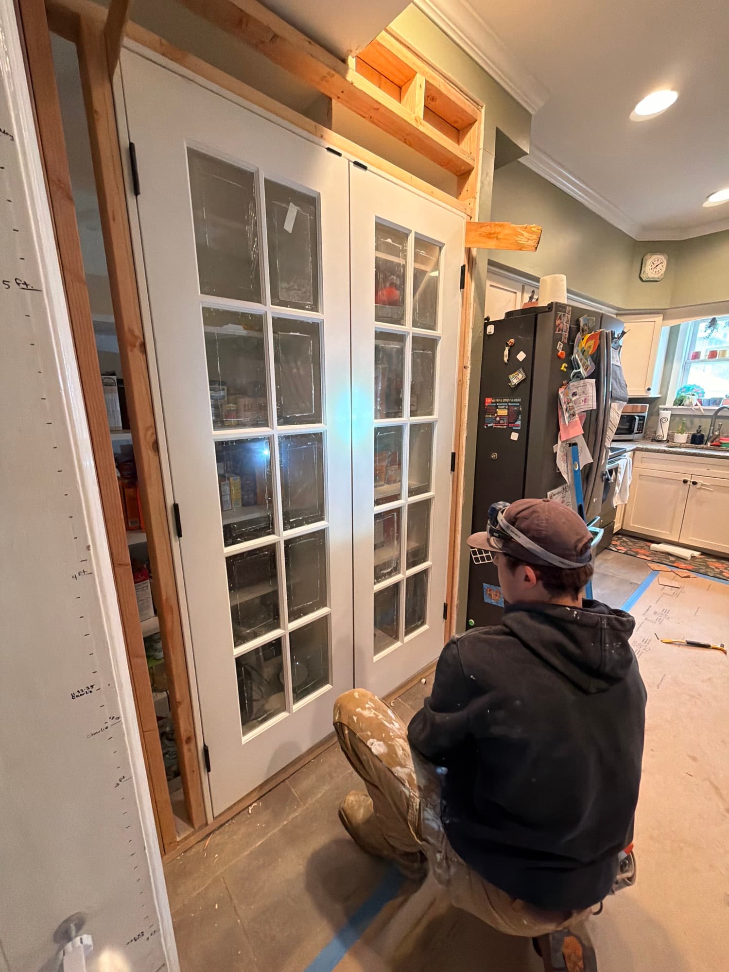 New door header and framing installed off a kitchen