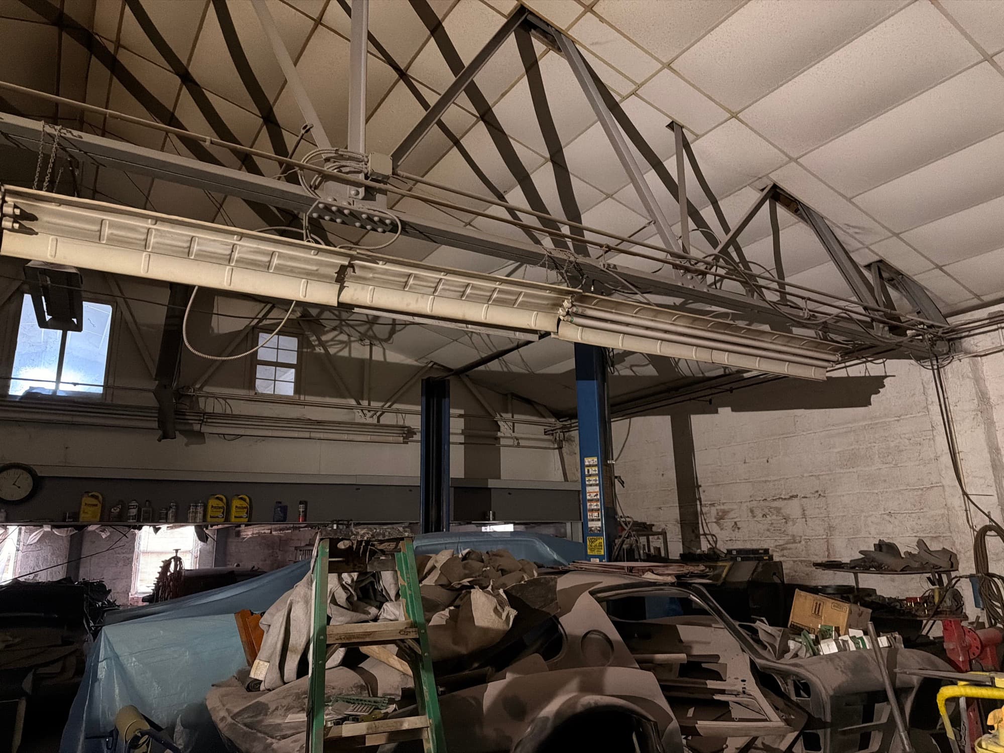Exposed structural framing and roof trusses in a shop building